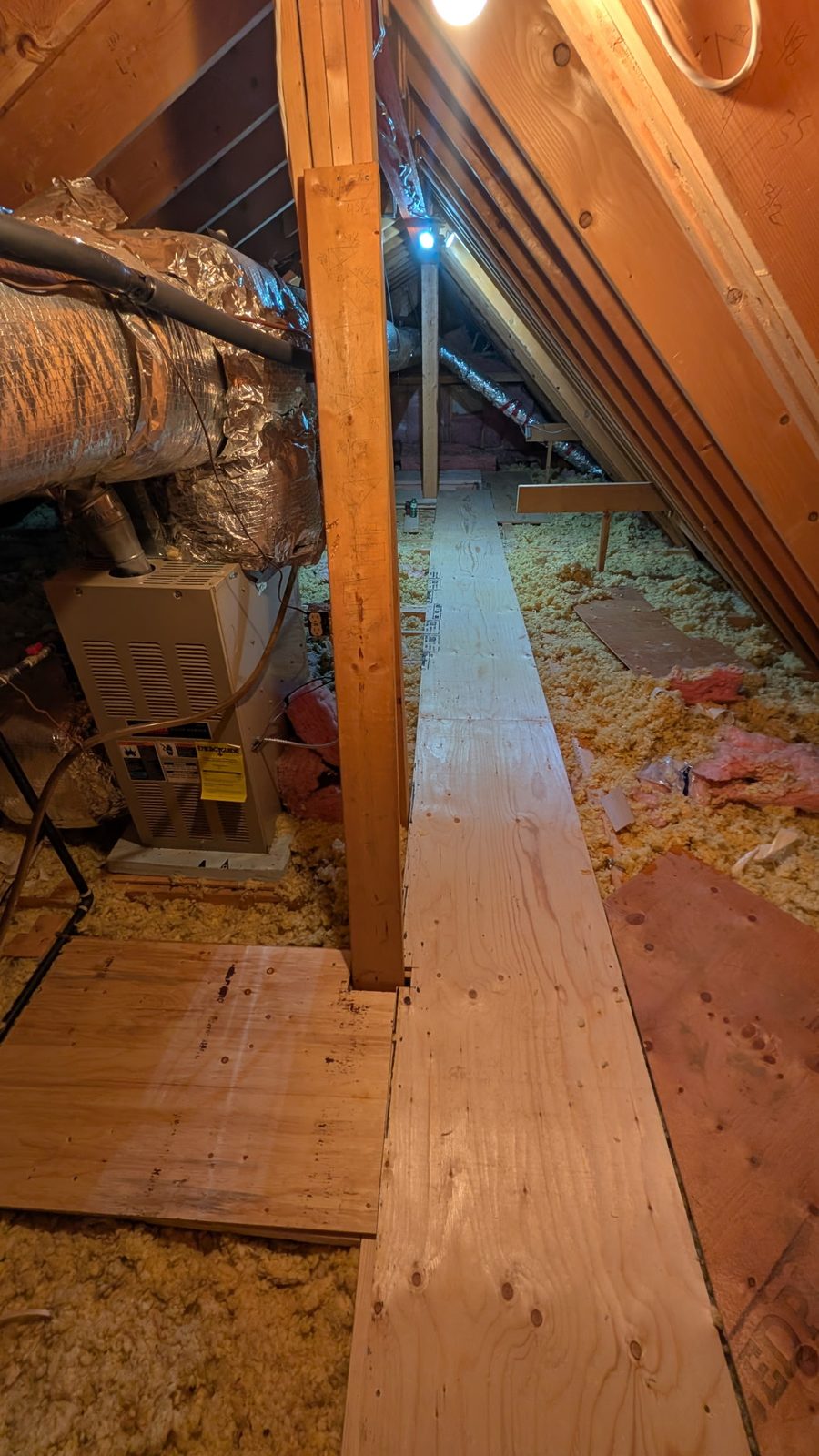 Nobleton attic after installation of a dedicated plywood furnace access walkway